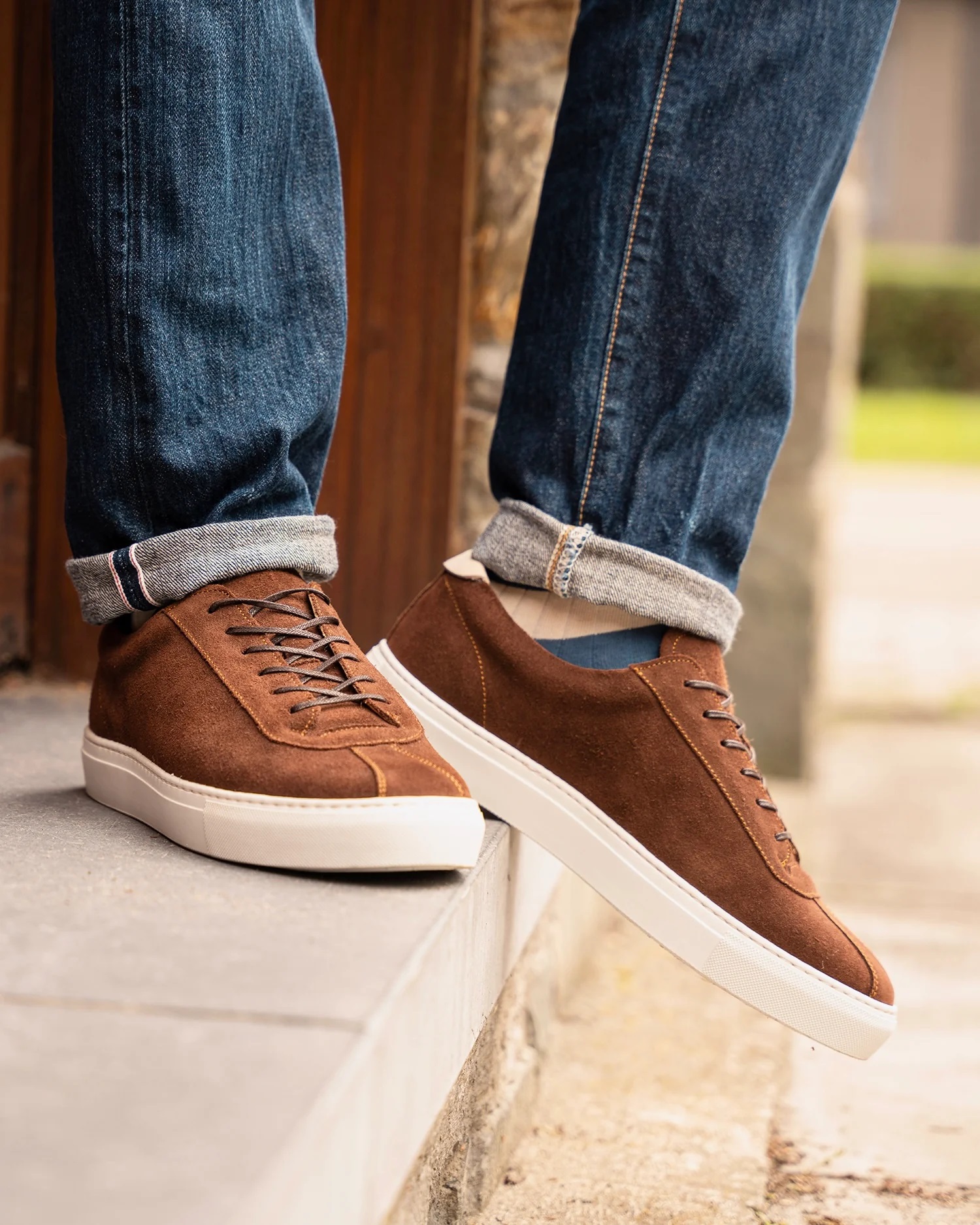 Brown suede sneakers + navy jeans